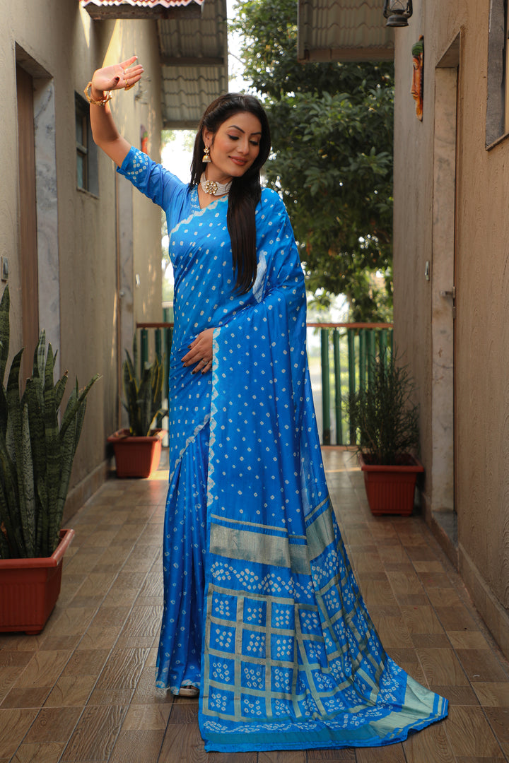 Beautiful blue Bandhej silk saree with luxurious checks pattern for festive wear.