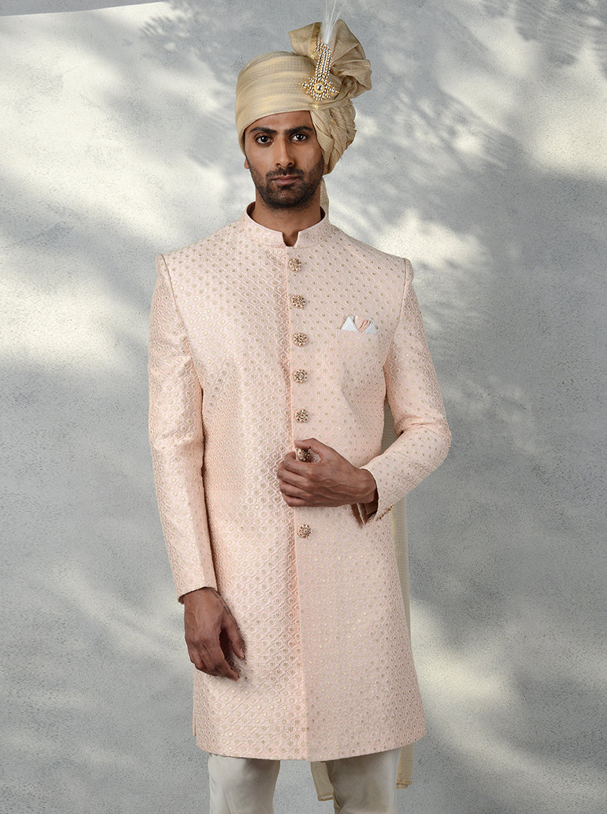 Stylish men's Indo Western outfit in pink with intricate embroidery, sequins work, and mandarin collar.