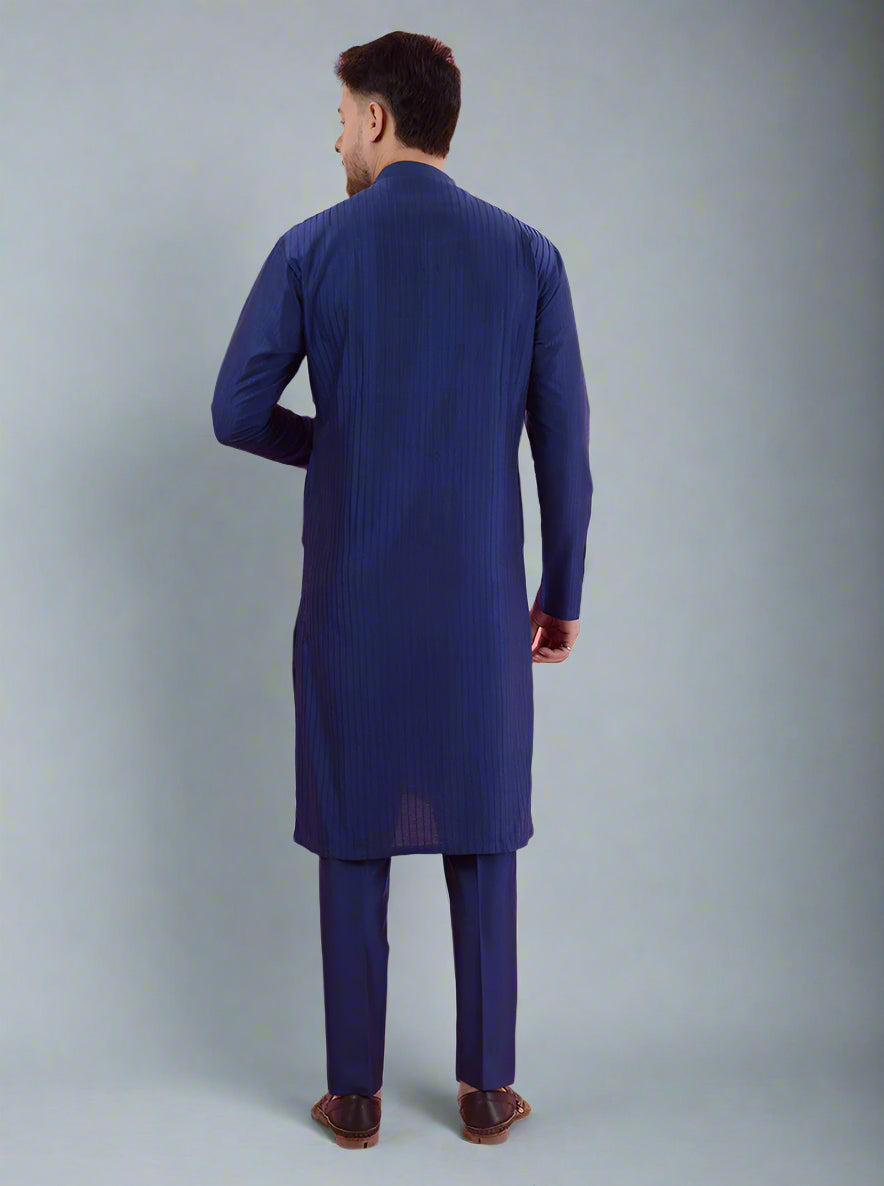 Navy blue kurta pajama for men with intricate embroidery, designed for traditional occasions.