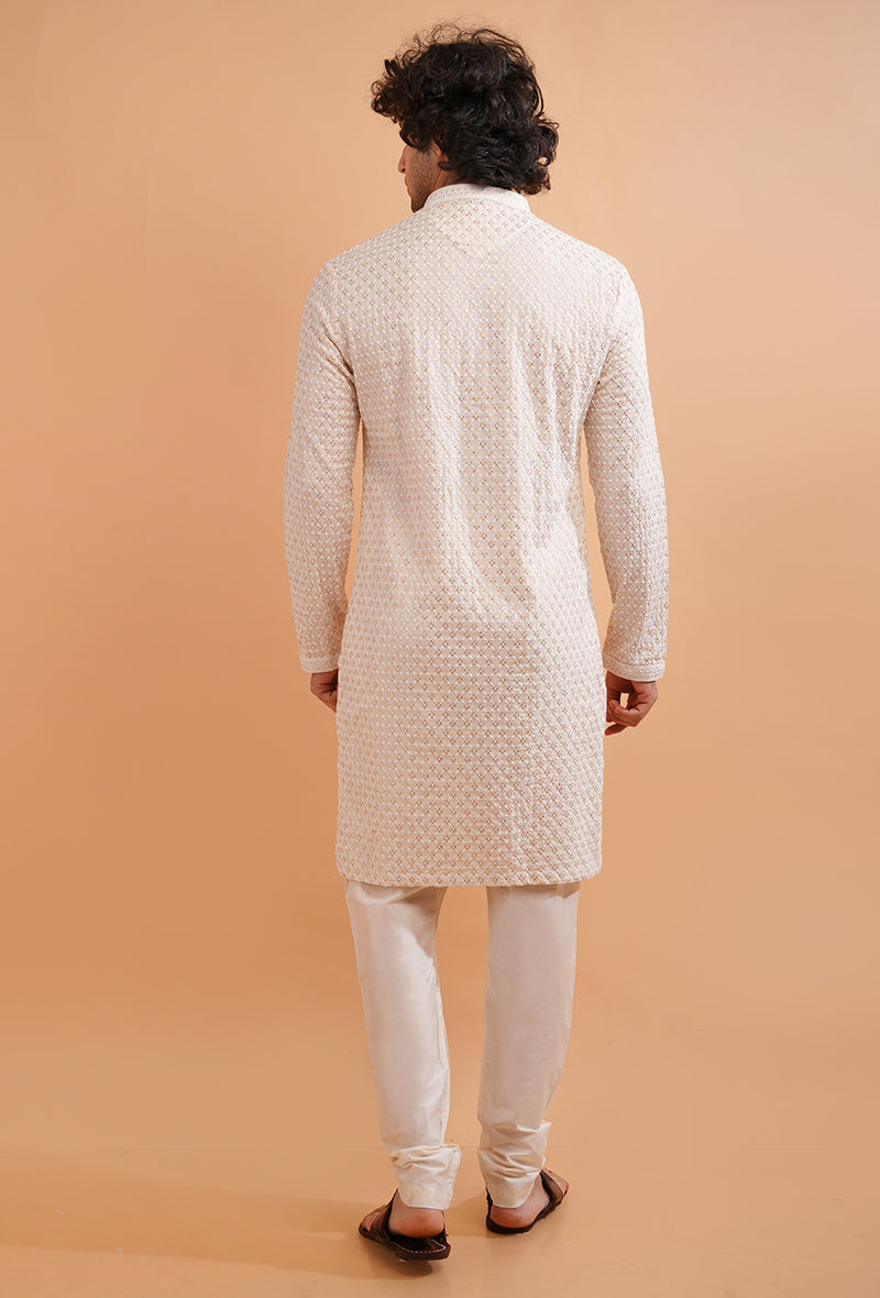 Men’s traditional cream silk blend kurta pajama set, designed for formal and festive occasions.