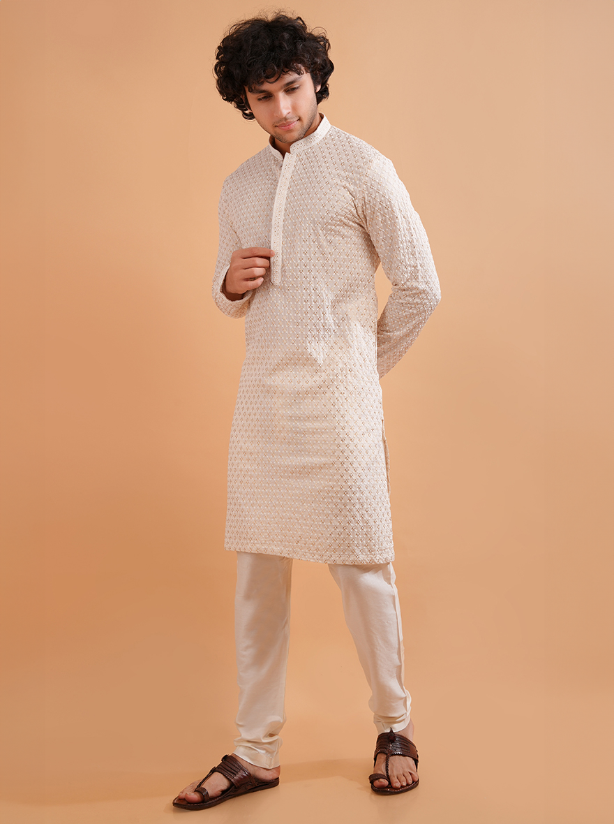 Cream silk kurta pajama, crafted with embroidery, a USA men’s festive essential.