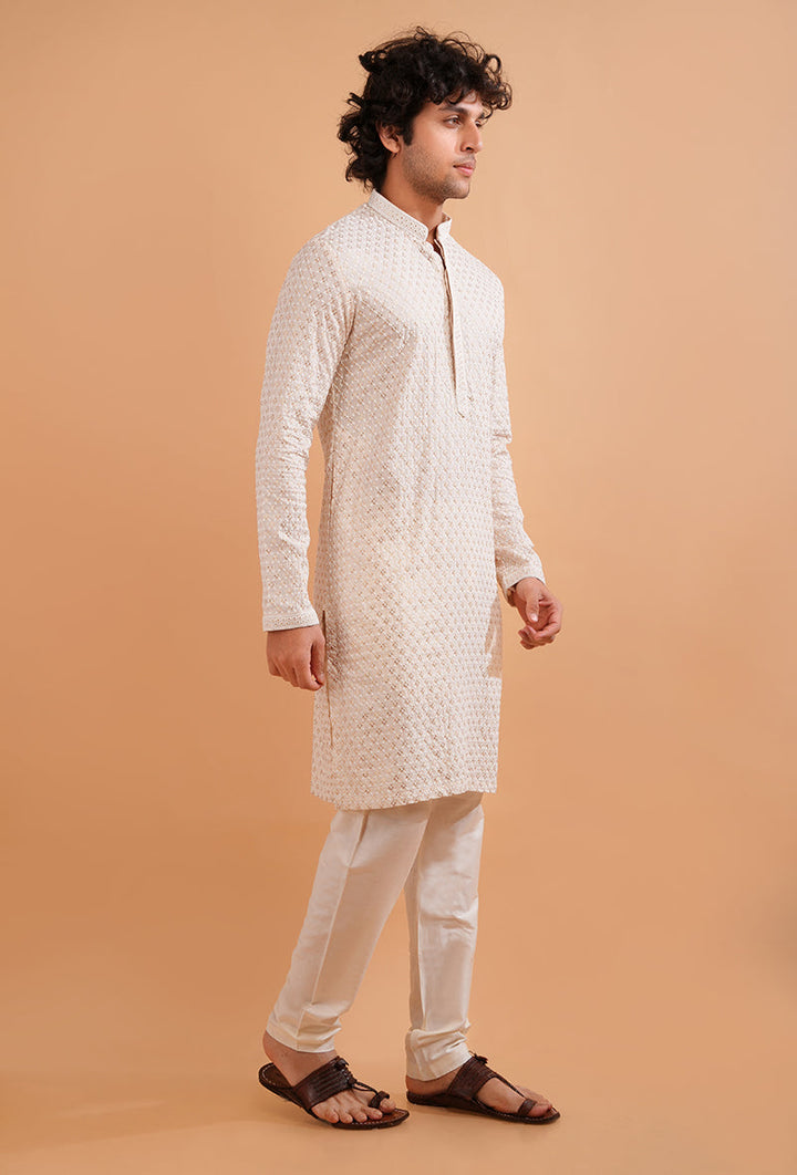 Sophisticated cream kurta pajama with intricate embroidery, ideal for USA gatherings.