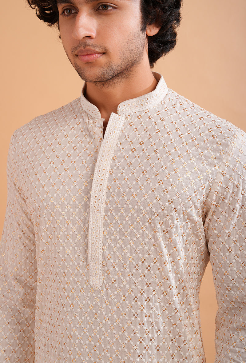 Cream silk blend kurta pajama set for men, ideal for elegant weddings and cultural celebrations.