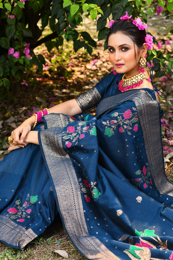 Stunning dark green saree in tussar silk with intricate zari patterns, ideal for weddings and events.