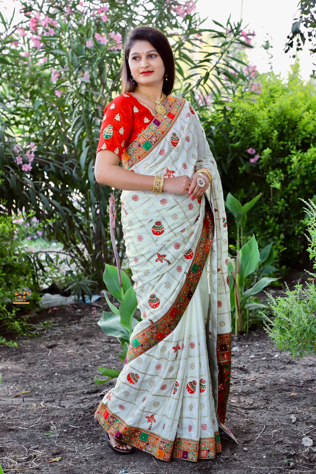 Beautiful yellow Dola Silk saree with heavy jacquard lace and delicate embroidery details for celebrations.