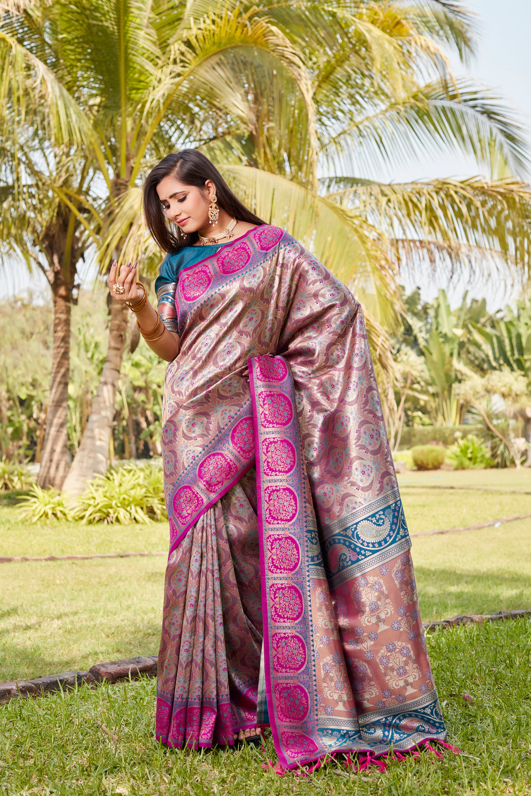 Designer bright-pink Kanjivaram silk saree with exquisite work and rich pallu, ideal for weddings.