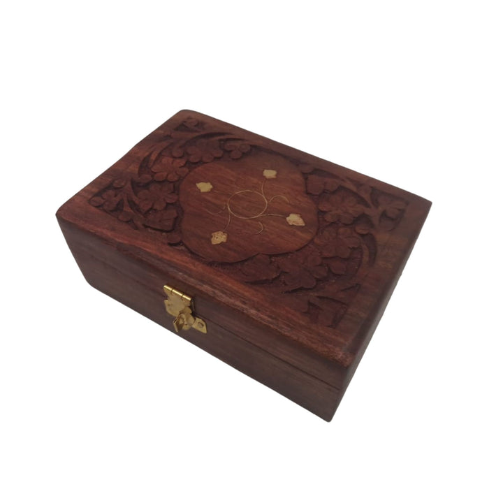 Decorative wooden jewelry box for elegantly storing and displaying your favorite pieces.