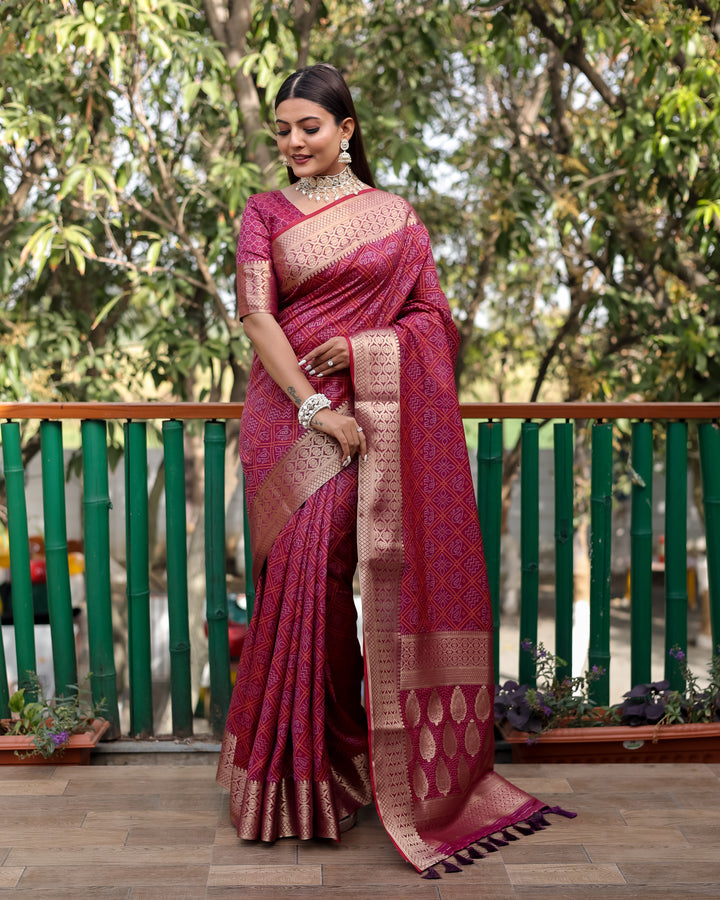 A rich maroon Pure Handloom Bandhej Patola Silk Saree with intricate patterns, ideal for traditional Indian weddings.