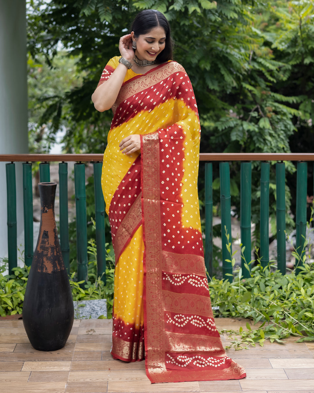 Stunning yellow Bandhej silk saree with delicate zari work and matching blouse, perfect for weddings and special events.