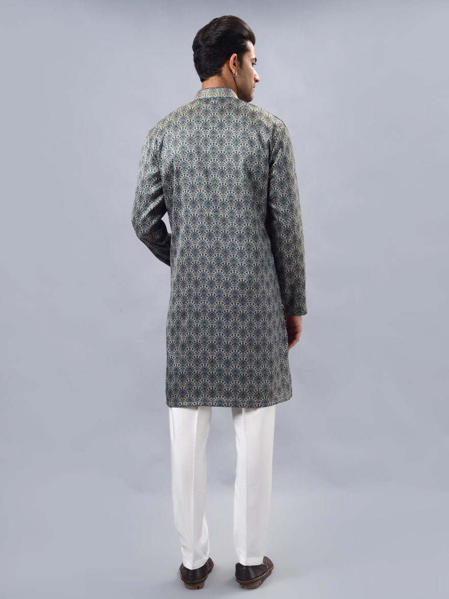 Luxurious green silk blend kurta pajama set for men, crafted for elegance at traditional events.