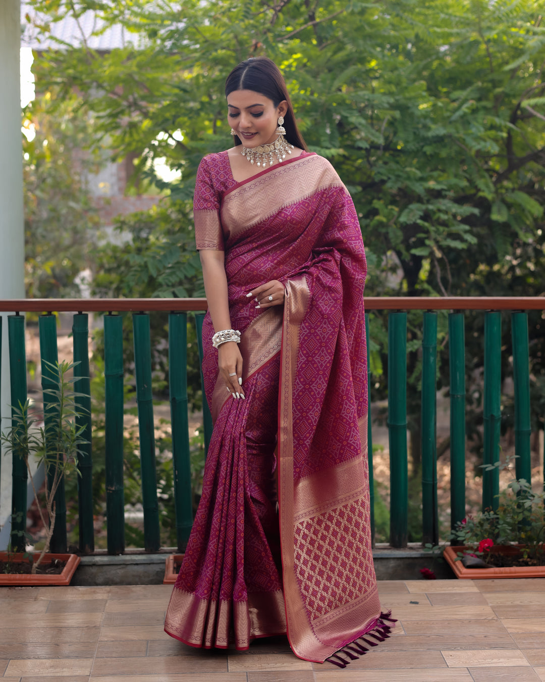 Exquisite maroon Patola silk saree showcasing a vibrant woven pallu, ideal for festive occasions.