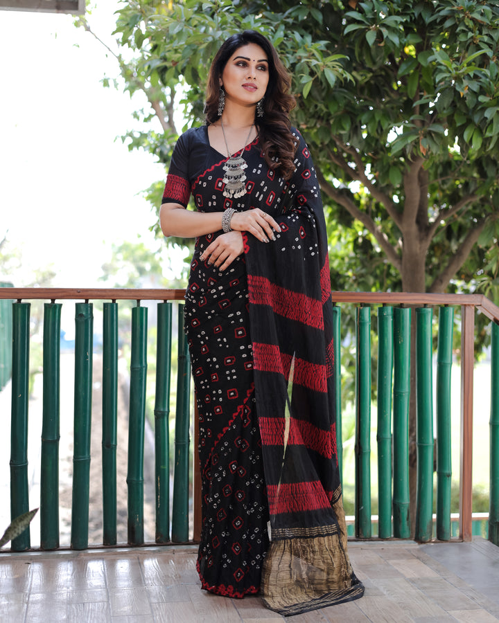 Exquisite Bandhej silk saree in black with intricate zari weaving and a rich tissue pallu, perfect for any special occasion.