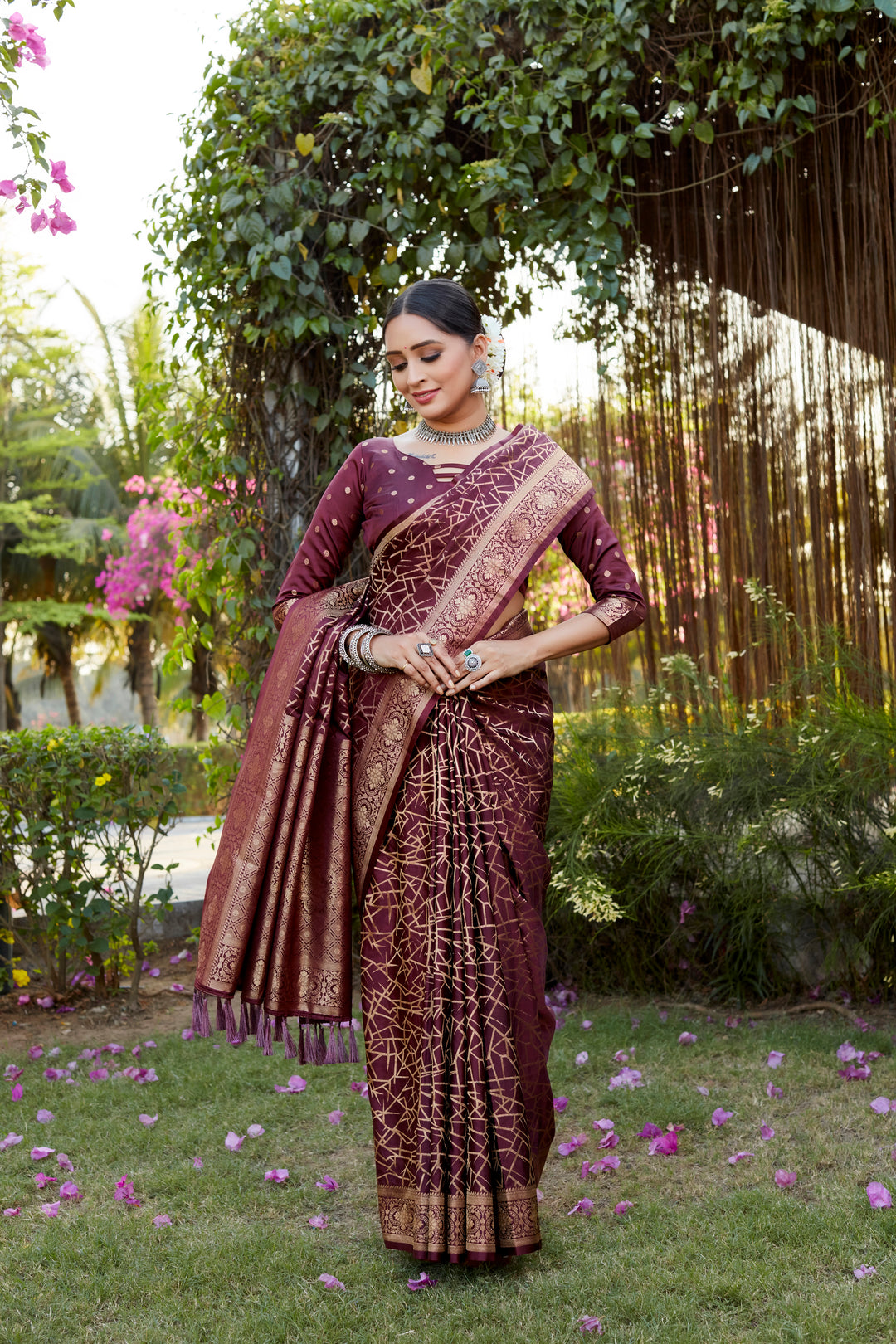 Gorgeous wine Kanjivaram soft satin silk saree with detailed butta work, perfect for bridal and formal wear.