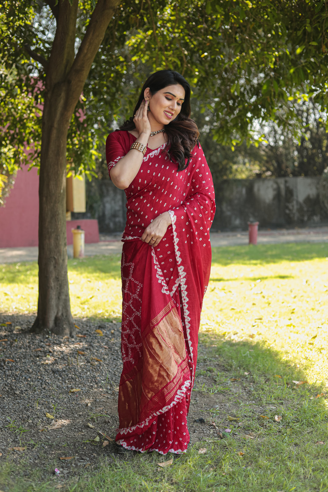 Stunning Red Bandhej Silk Saree with original design and Zari weaving, ideal for festive occasions.