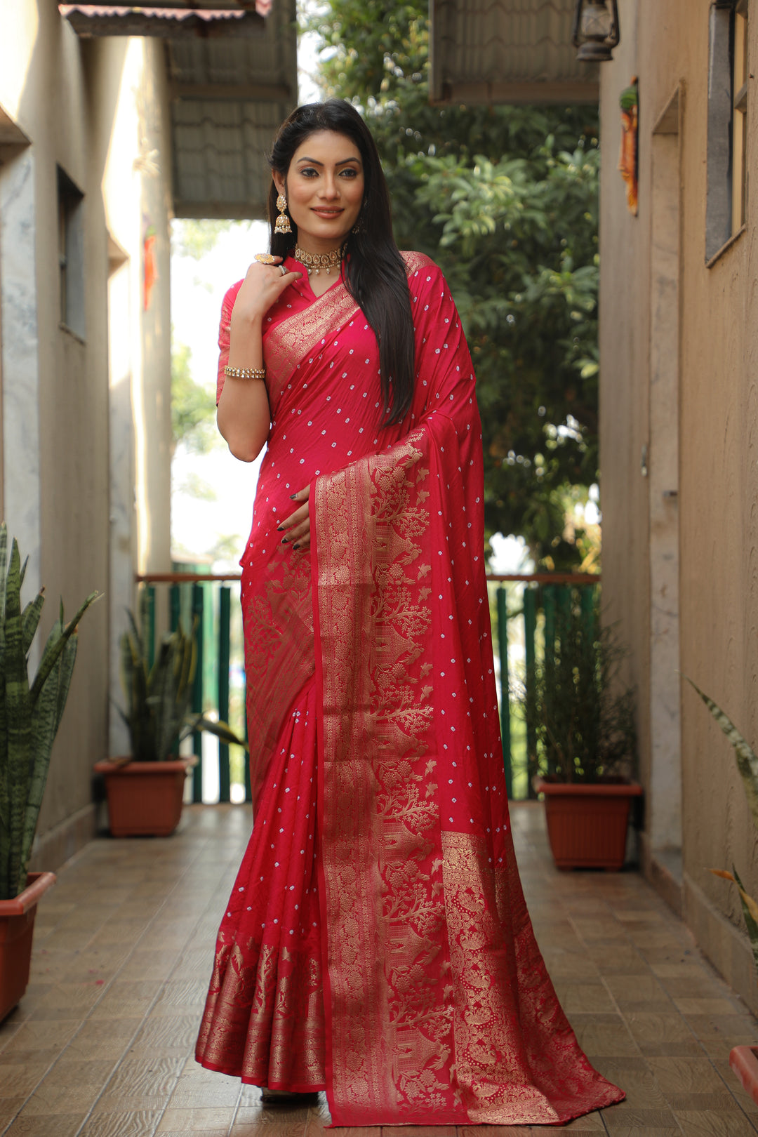 Bright pink Kanjivaram silk saree with rich pallu and intricate design, perfect for festive occasions.