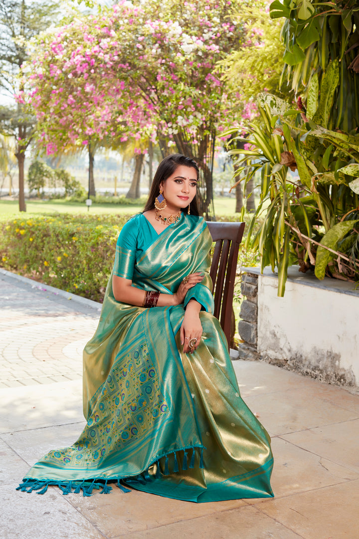 Elegant green tissue silk saree with contrast blouse and rich pallu, perfect for traditional celebrations.