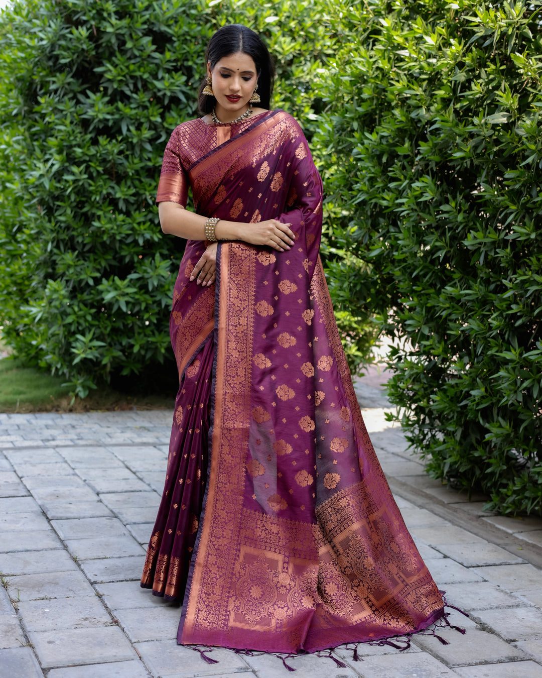 Timeless purple soft silk saree with intricate zari work, perfect for special gatherings and celebrations.