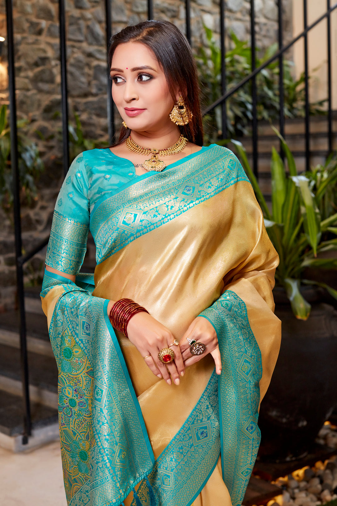 Timeless golden Tissue silk saree with delicate weaving and eye-catching contrast border.