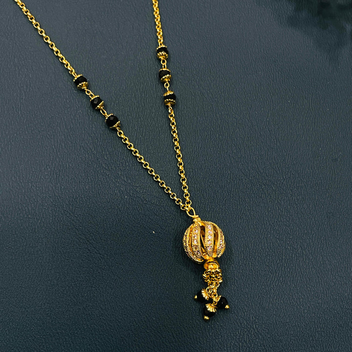 Traditional black and gold mangalsutra, crafted in high-quality alloy, stylish design.