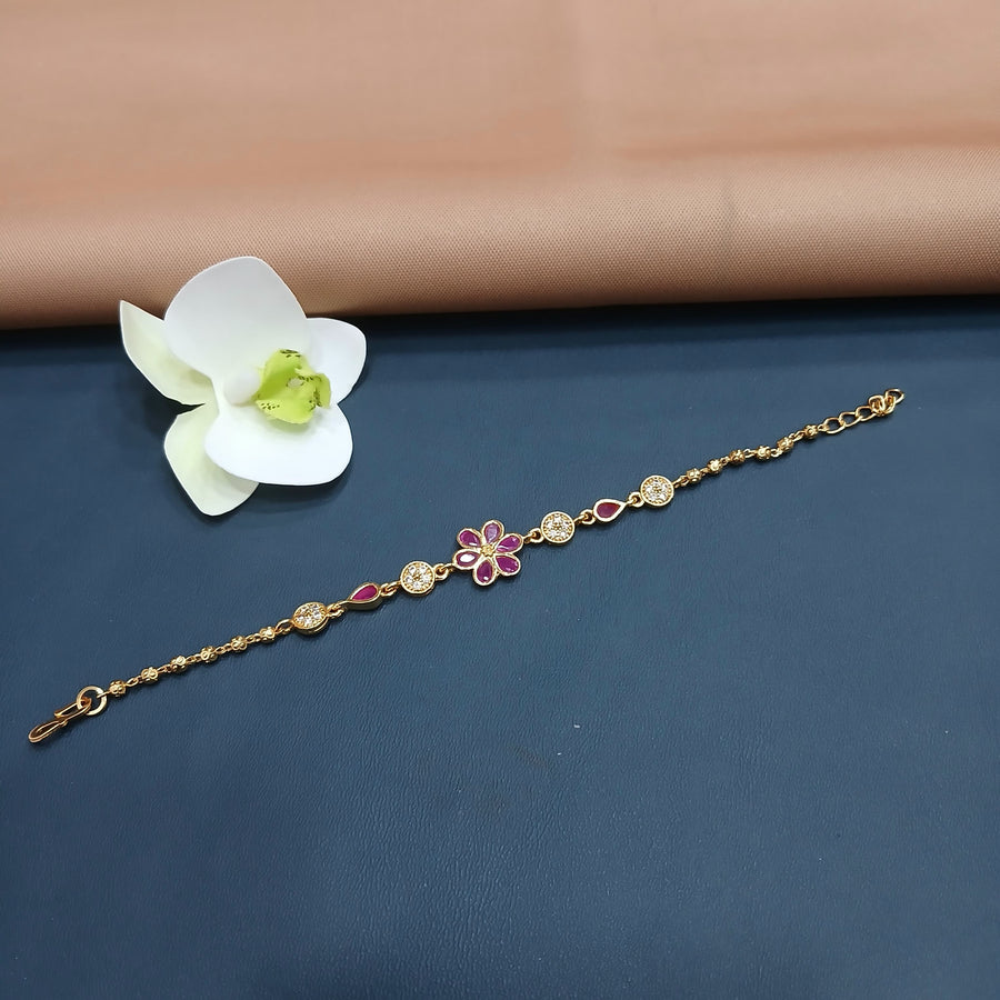 Luxurious golden bracelet with gemstone embellishments, great for evening attire.