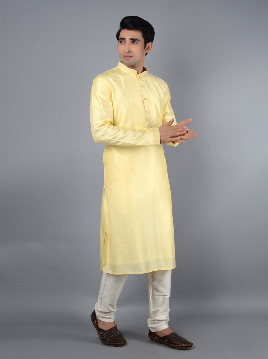 Unique light yellow kurta pajama for stylish men during festivities.