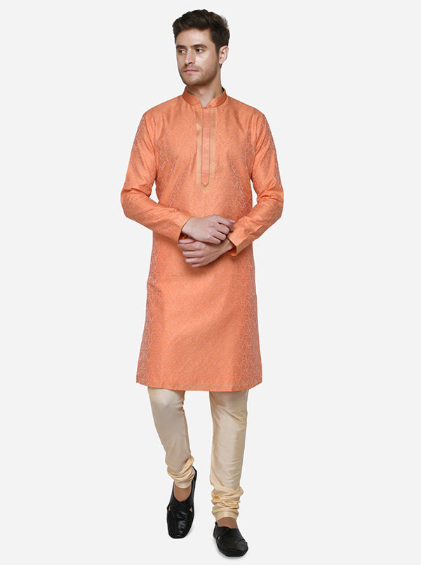 Elevate your ethnic collection with this stylish coral orange kurta set for men.