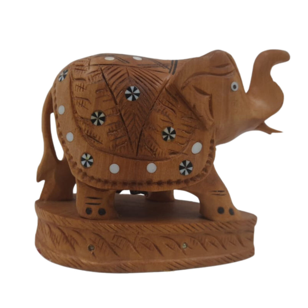 Carved wooden elephant with up trunk symbolizing good fortune