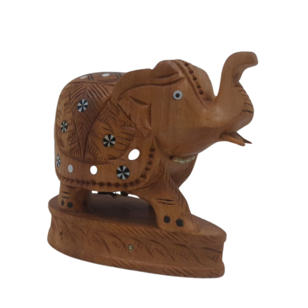 Handcrafted wooden elephant figurine with raised trunk for prosperity