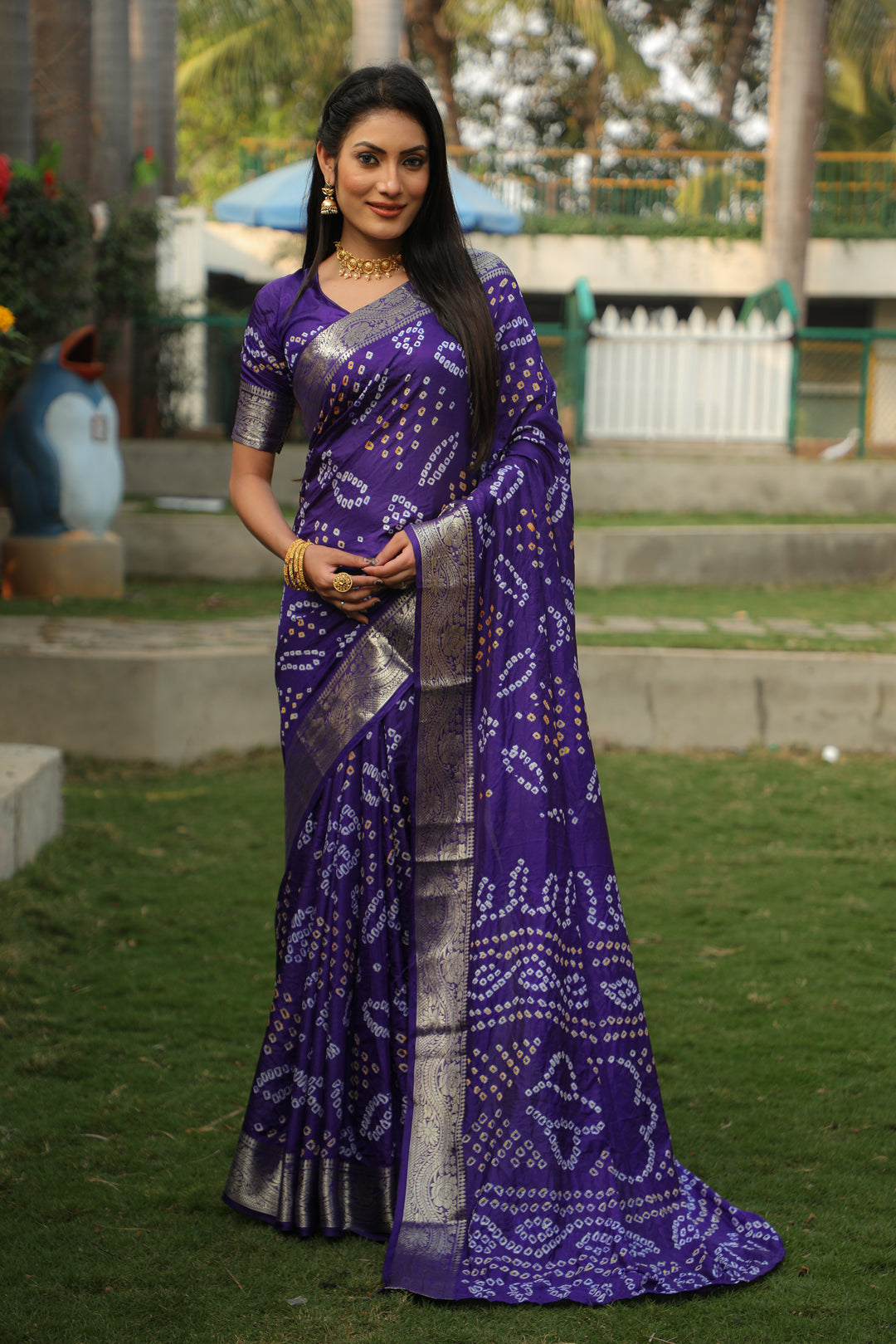 Elegant pink Bandhej silk saree with intricate jari weaving and a beautiful Bandhej pallu, ideal for cultural events.