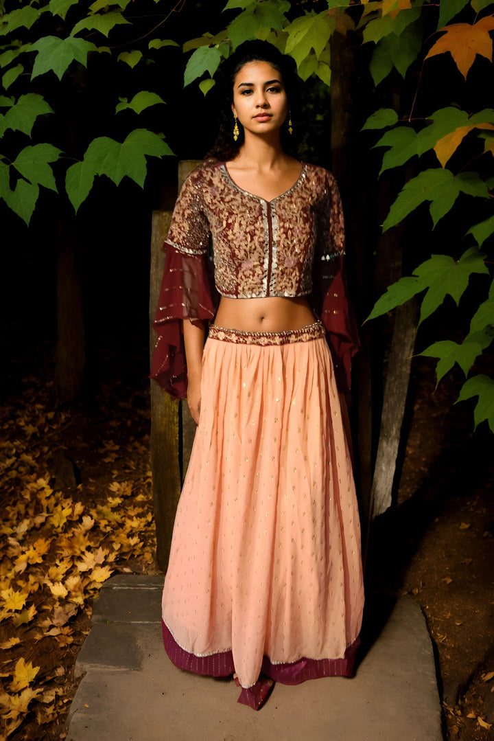 Chic floral crop top skirt lehenga on cream georgette fabric, perfect for summer gatherings and stylish festive occasions.