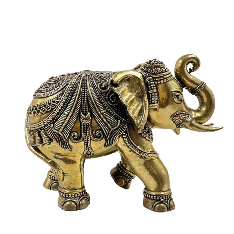 Golden brass elephant up trunk showpiece, a symbol of good luck and prosperity.