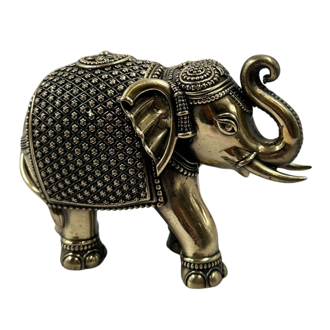 Brass elephant showpiece with up trunk, a symbol of good luck and prosperity.