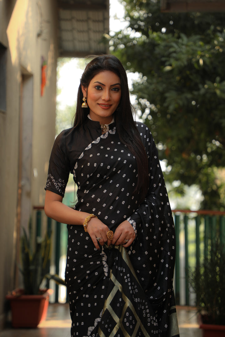 Elegant black Bandhej silk saree with stylish checks and luxurious Bandhej craftsmanship.