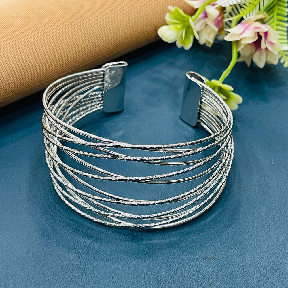 Stylish silver bracelet featuring playful charms, ideal for casual outfits.