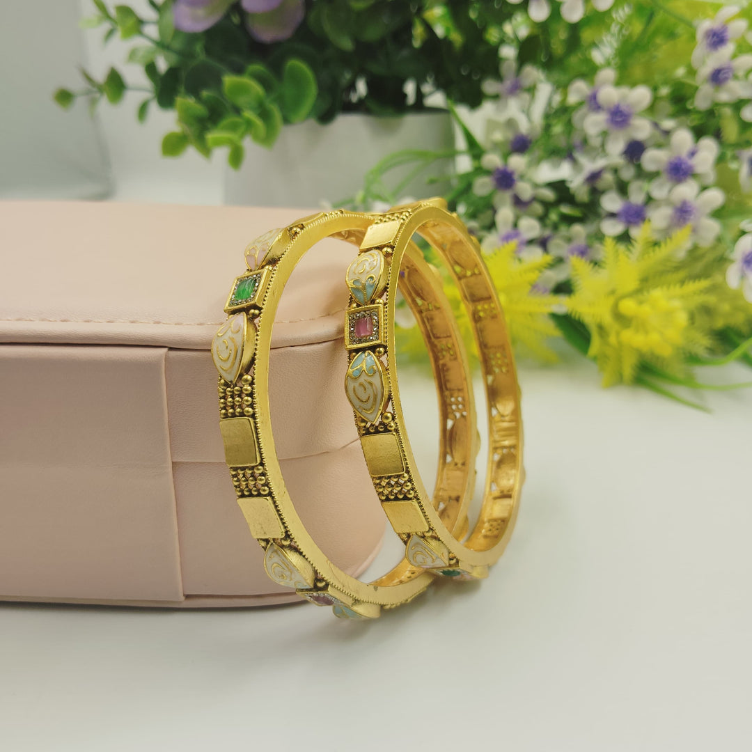 Classic golden bangles that represent timeless elegance.