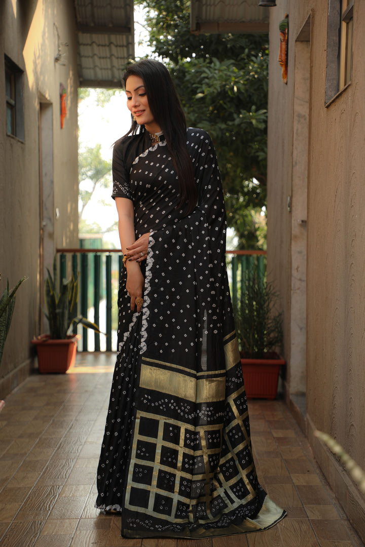 Timeless teal-green Bandhej silk saree with elegant checks design, perfect for special occasions.