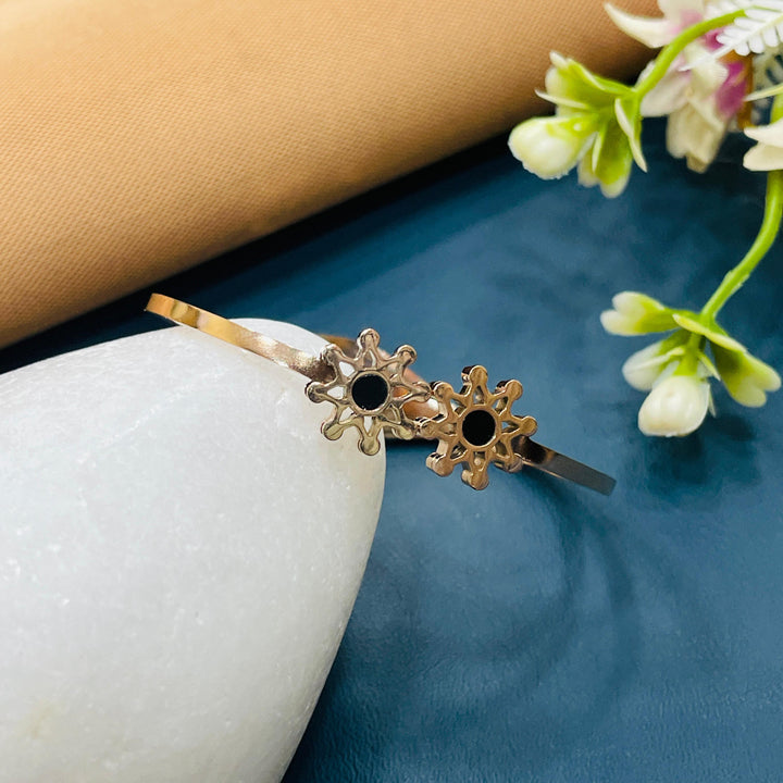 Trendy rose gold bangle with cubic zirconia accents, a stylish accessory for any occasion.