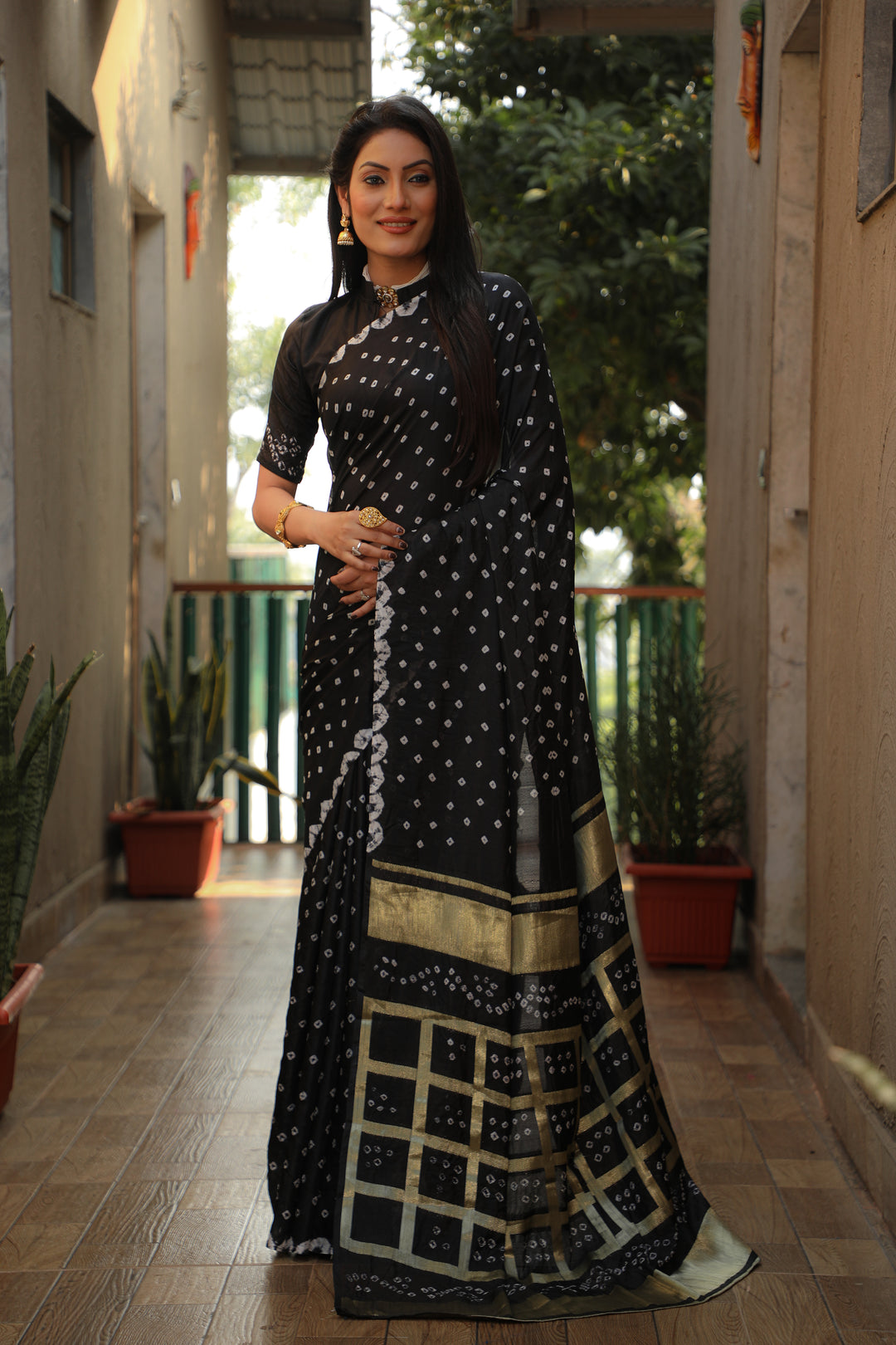 Timeless black Bandhej silk saree with beautiful checks design and original craft.