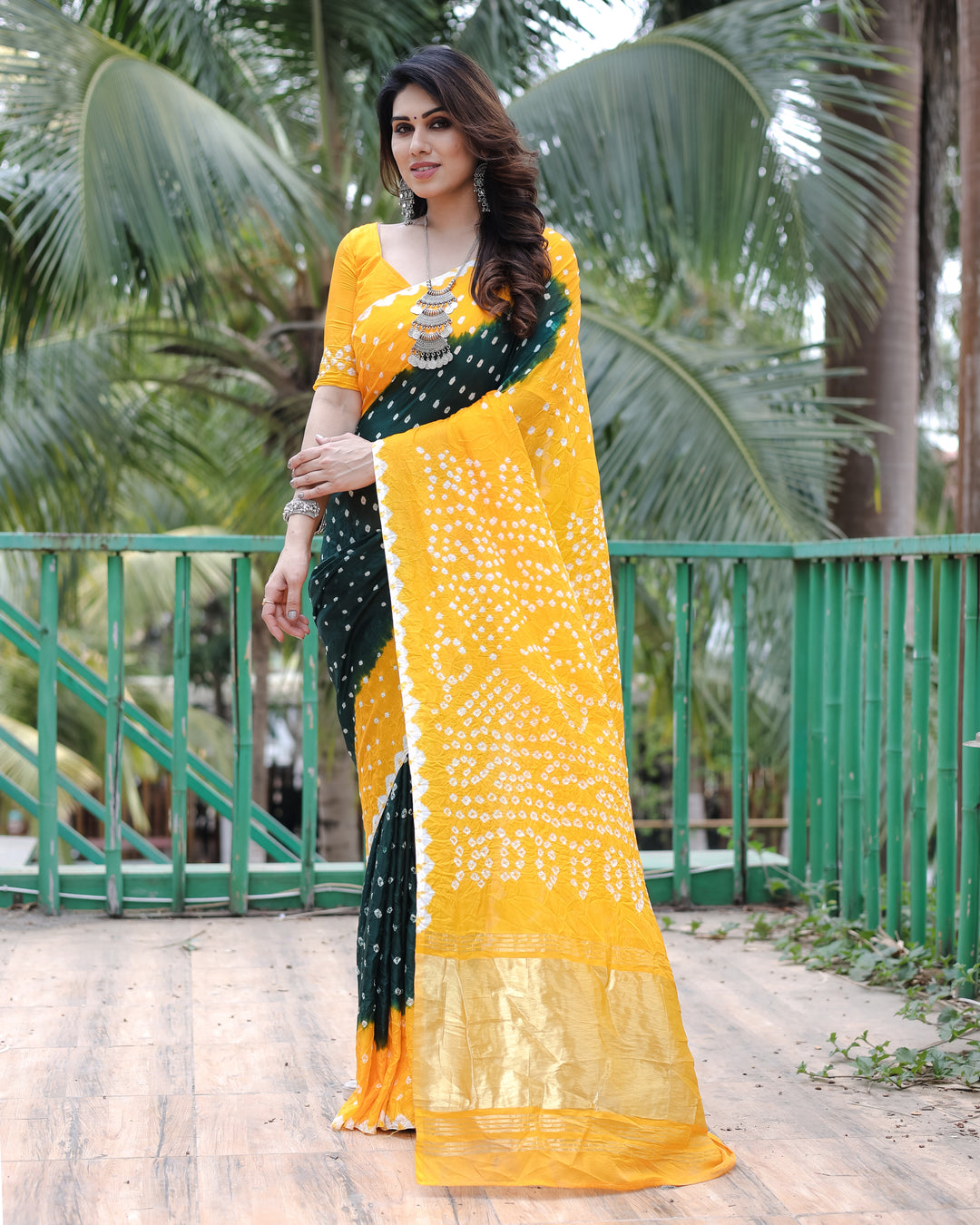 Elegant Yellow Bandhej Silk Drapes with Zari Tissue Pallu and blouse piece for a stunning appearance.