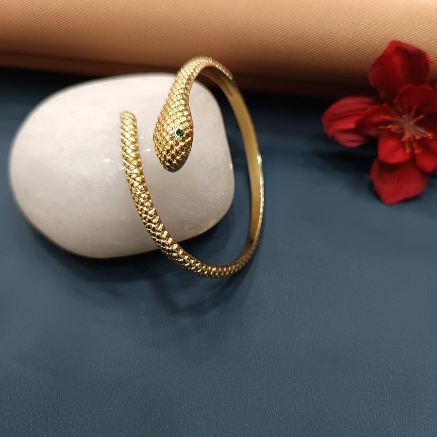 Trendy golden bracelet with a modern cuff style.