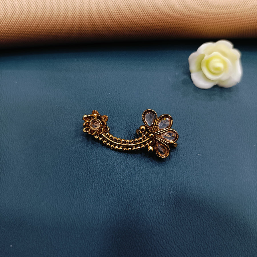 Stunning golden nose ring featuring intricate lacework, great for formal events.