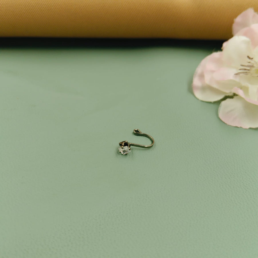 Chic silver nose ring with a modern twist, suitable for everyday elegance.