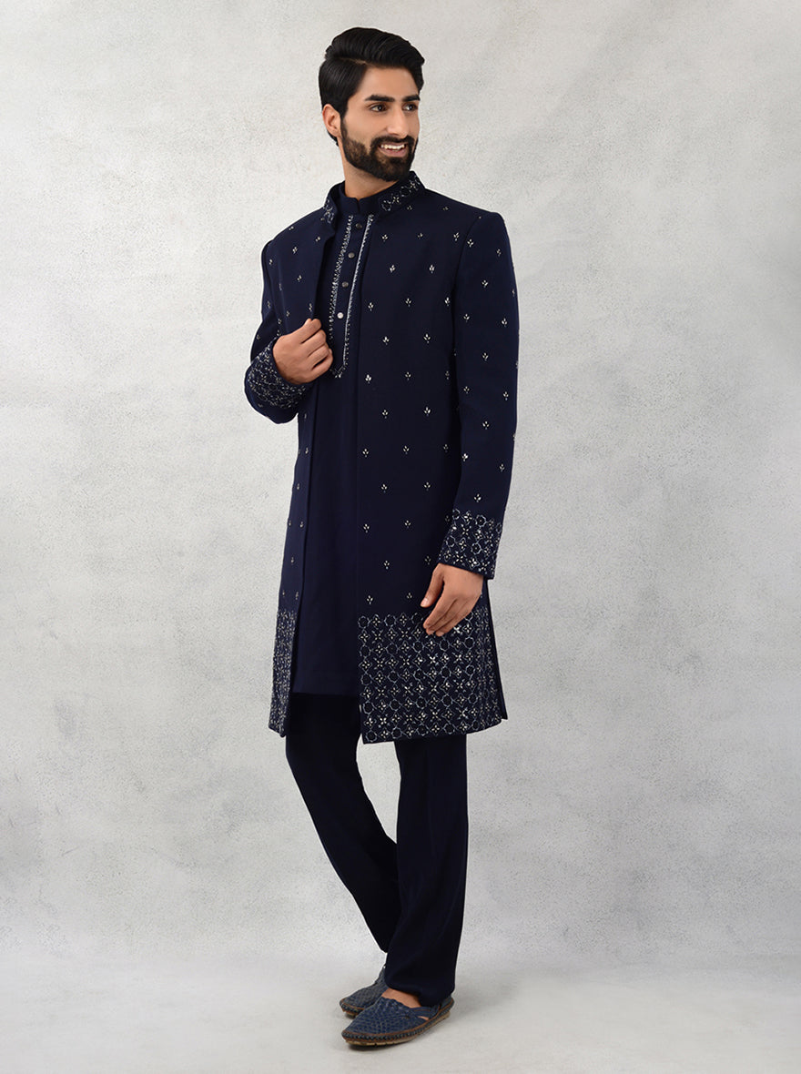 Celebrate in style with this elegant navy blue sherwani, made from premium Sun Silk, ideal for making a lasting impression at weddings.