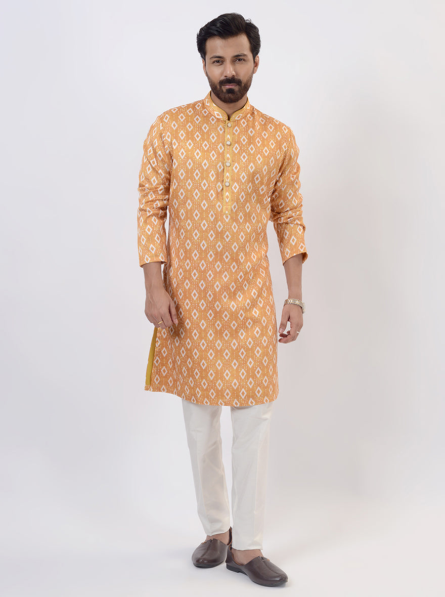 Men's mustard yellow kurta pajama with Ikat printed design, ideal for USA celebrations.