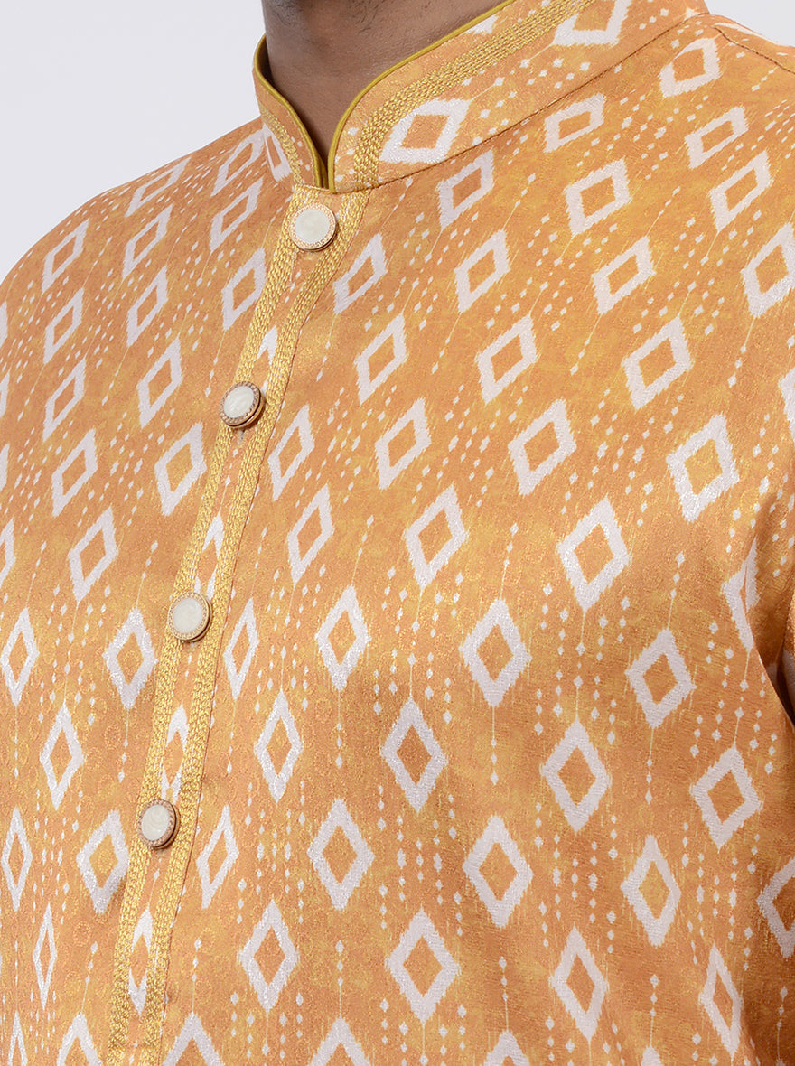 Elegant mustard yellow silk blend kurta pajama, featuring Ikat print for a traditional look.