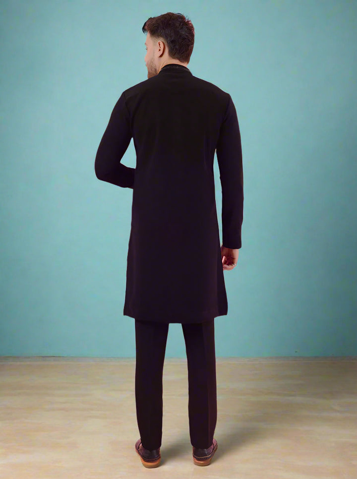 Navy blue embroidered kurta pajama set for men, crafted from silk blend for luxurious wear.