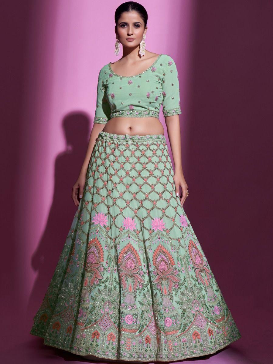 Elegant pista green lehenga with zari work and matching choli.