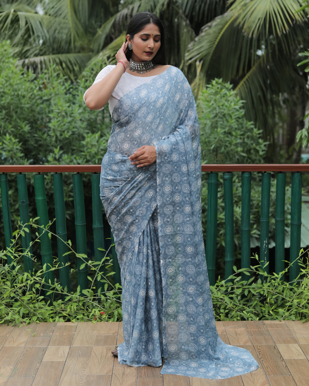 Stunning grey chiffon saree with foil detailing, ideal for weddings and festive celebrations.