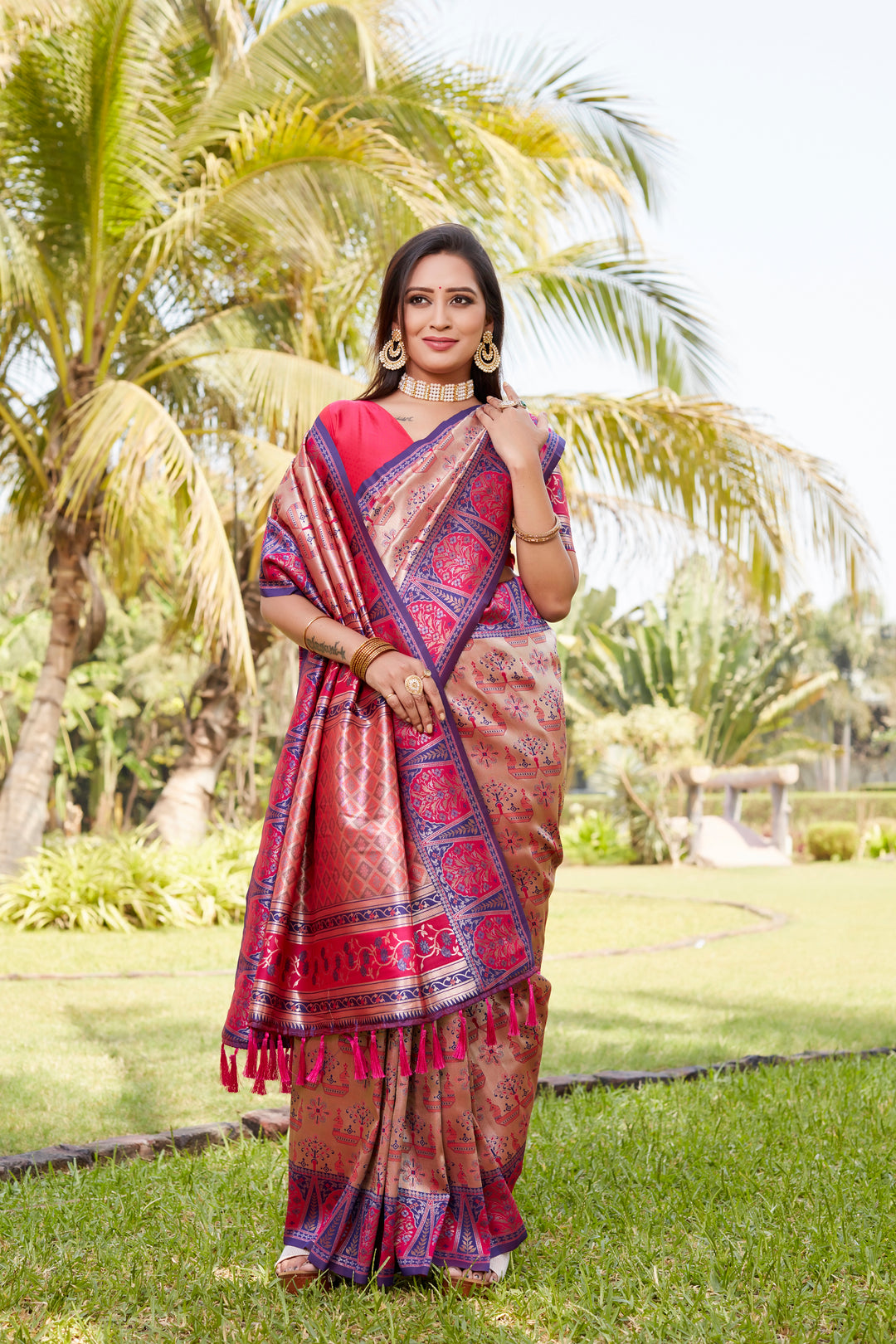 Traditional pink Kanjivaram silk saree adorned with beautiful weaving and zari borders, perfect for any special occasion.