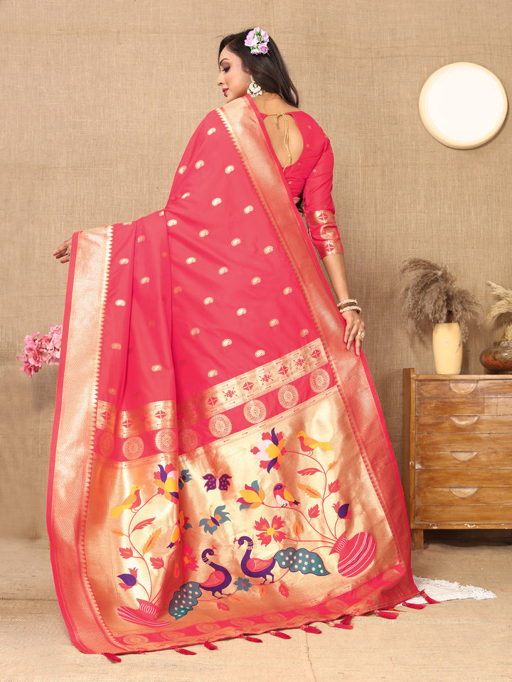 Sophisticated pink Paithani silk saree with intricate zari and meenakari, paired with a matching blouse.